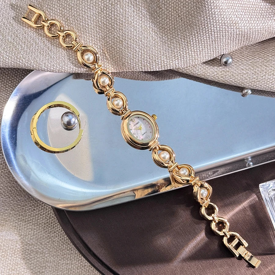 Nouvelle mode de luxe Imitation perle français romantique ovale forme dames Bracelet montre haute esthétique montre à Quartz