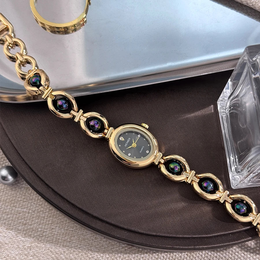 Nouvelle mode de luxe Imitation perle français romantique ovale forme dames Bracelet montre haute esthétique montre à Quartz